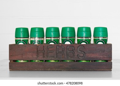 Kitchen Appliance Decoration. Wooden Box With The Word Herbs And Spice Containers