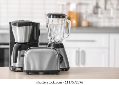 Kitchen appliances on table against blurred background - Powered by Shutterstock