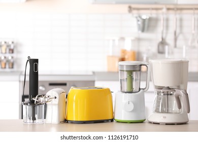 Kitchen appliances on table against blurred background - Shutterstock ID 1126191710
