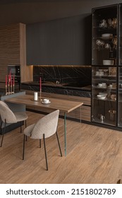 Kitchen Area In A Chic Expensive Interior Of A Luxury Home With A Dark Black And Brown Modern Design With Wood Trim And Led Light