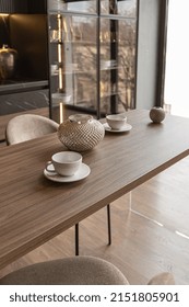 Kitchen Area In A Chic Expensive Interior Of A Luxury Home With A Dark Black And Brown Modern Design With Wood Trim And Led Light