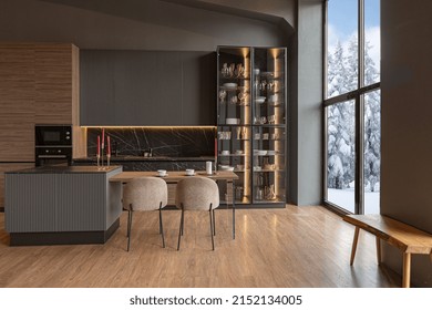 kitchen area in a chic expensive interior of a luxury home with a dark black and brown modern design with wood trim and led light - Shutterstock ID 2152134005