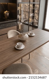 Kitchen Area In A Chic Expensive Interior Of A Luxury Home With A Dark Black And Brown Modern Design With Wood Trim And Led Light