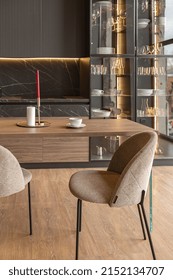 Kitchen Area In A Chic Expensive Interior Of A Luxury Home With A Dark Black And Brown Modern Design With Wood Trim And Led Light