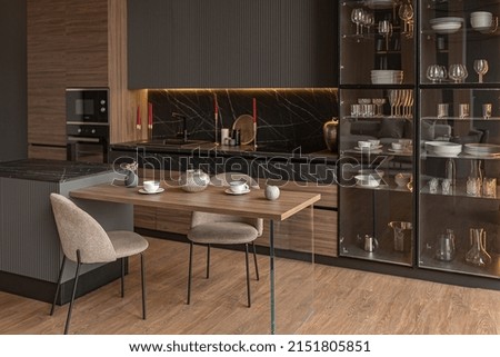 kitchen area in a chic expensive interior of a luxury home with a dark black and brown modern design with wood trim and led light