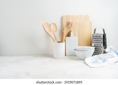 Kitchen Background Mockup With Teepot And Cooking, Baking Utensils Rolling Pin, Cutboard, Bowls On The Table On White Background. Blank Space For A Text, Home Kitchen Decor Concept. 