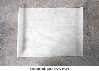 Kitchen bakery white paper sheet top view on stone table.Food advertisement empty blank.Baking sheet.White dish.
