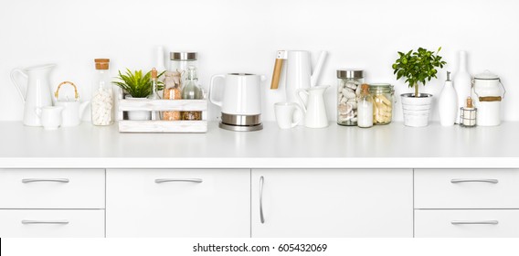 Kitchen Bench Full Of Various Utensils Isolated On White Background