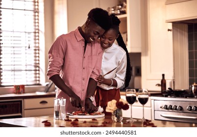 Kitchen, black couple and happy with wine glass in cooking dinner for support, bonding and roses. Home, relationship and people for anniversary celebration, relax and romantic with meal and alcohol - Powered by Shutterstock