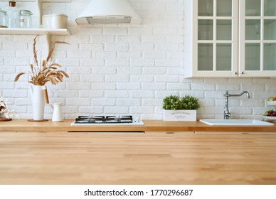 Kitchen Blured Background Interior With Wooden Table.