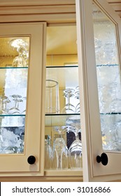 Kitchen Cabinet Close Up With Glass Shelves And Glasses