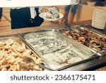 The kitchen of the cafeteria is a buffet with food at school or college. A showcase with self-service food. High quality photo