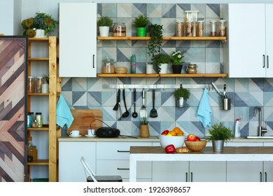 Kitchen Close Up Fragment With Pot Plants, Utensils, Peas And Beans In Container