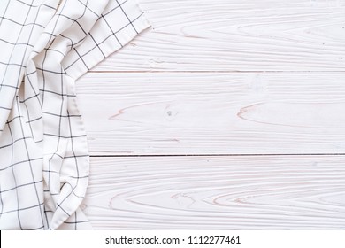 kitchen cloth (napkin) on wood background with copy space