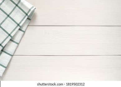 Kitchen Cloth On Side Of White Wooden Table, Top View, Copy Space