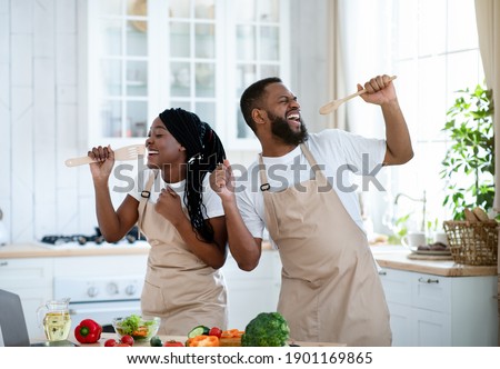 Similar – Image, Stock Photo black women friends using smartphone having fun in the city