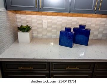 Kitchen Counter Top With Backsplash And Blue Ceramic Containers