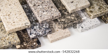 Kitchen countertops color samples laying on over other in different colors