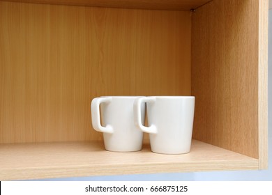 Kitchen Cupboard With White Cups