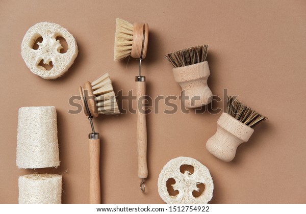 Kitchen Dish Brushes on Isolated\
Beige Background Side View Copy Space. Little Mug Made from Ecology\
Clean Nature Material Clay with Eco Clean Bath\
Accessory