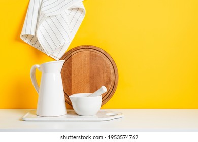 Kitchen Dishware Background With A Blank Space For A Text, Home Kitchen Decor Concept. Yellow Wall, Front View