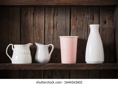 kitchen dishware on old dark wooden background