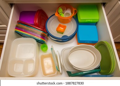 Kitchen Drawer Filled With Colorful Plastic Storage Containers