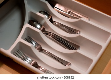 A Kitchen Drawer Organizer Full Of Utensils