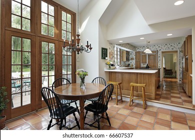 Kitchen And Eating Area With Spanish Tile