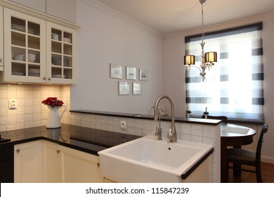 Kitchen With Farmhouse Sink And Round Table