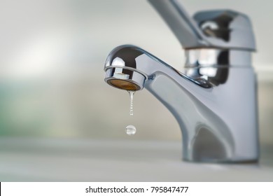 Kitchen faucet with drop - Shutterstock ID 795847477