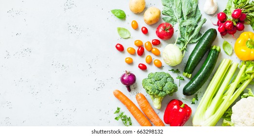 Kitchen - fresh colorful organic vegetables captured from above (top view, flat lay). Grey stone worktop as background. Layout with free text (copy) space. - Powered by Shutterstock