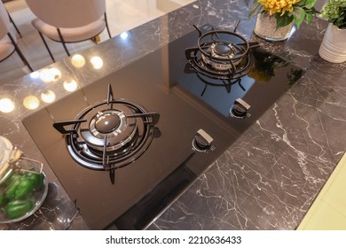 Kitchen Gas Stove On Black Marble Countertop. Modern Kitchen Interior.