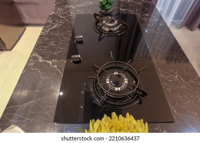 Kitchen Gas Stove On Black Marble Countertop. Modern Kitchen Interior.