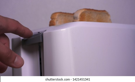 In The Kitchen, A Guy (girl) Pulls Out Food From The Refrigerator And Prepares Breakfast Next To The Toaster, Ready-made Toasters Are Pulled Out. Concept Of: Homemade Food, Comfort, Breakfast, Slow Mo