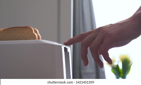 In The Kitchen, A Guy (girl) Pulls Out Food From The Refrigerator And Prepares Breakfast Next To The Toaster, Ready-made Toasters Are Pulled Out. Concept Of: Homemade Food, Comfort, Breakfast, Slow Mo