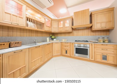 Kitchen Interior Designed In Beige Color And Decorated In Wood In Furniture Salon