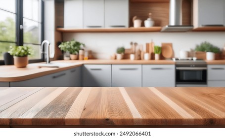 A kitchen interior, focusing on a wooden table or countertop in the foreground. The table has a natural wood finish with visible grain patterns. The ambiance is warm and inviting.