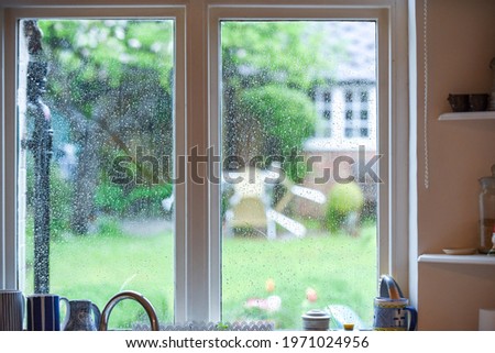 Kitchen interior view on a rainy day looking through window