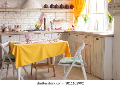 kitchen interior with yellow curtains and yellow tablecloth on the table