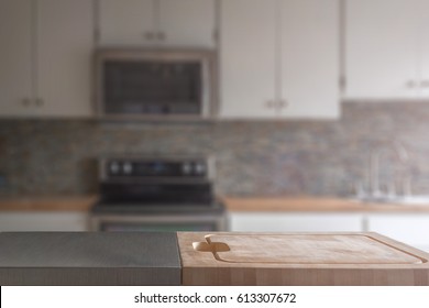 Kitchen Island Wood Butcher Block Top With Stove, Sink And Counter In Background, Selective Focus On Foreground