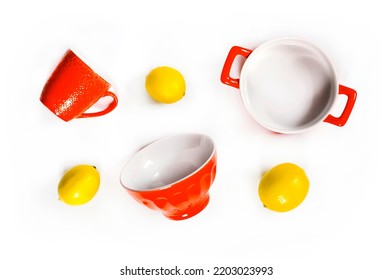 Kitchen and kitchenware. Yellow ceramic crockery tableware with fresh lemons isolated on white background. Flat lay, top view - Shutterstock ID 2203023993
