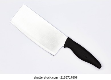 Kitchen Knife For Chopping Meat On White Background. Chef Butchers Knife For Cutting Meat. Boning Knife For Cutting Raw Meat. Kitchenware. Professional Food Preparation. Close-up. Top View. Isolated