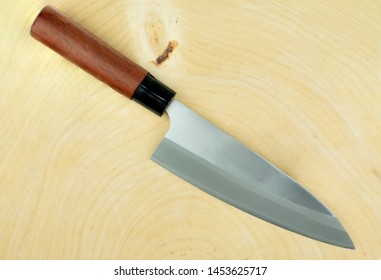 Kitchen Knife And Wood Butcher Block Countertop On White Background