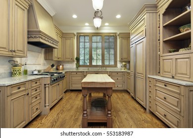 Kitchen In Luxury Home With Butcher Block Island.