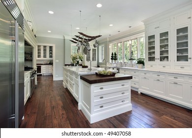 Kitchen In Luxury Home With White Cabinetry