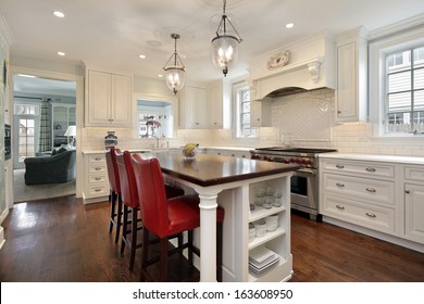 Kitchen In Luxury Home With Wood Counter Island