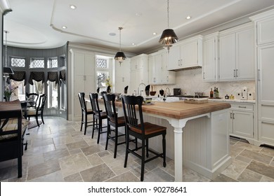 Kitchen In Luxury Home With Wood Counter Island