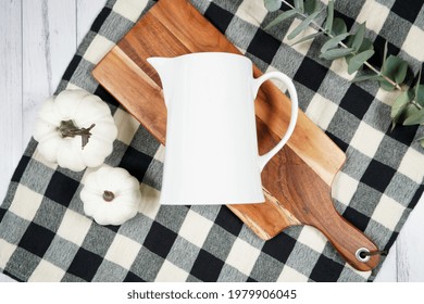 Kitchen Milk Jug Mockup. On-trend Farmhouse Aesthetic Flatlay Svg Craft Product Mock Up With Black Plaid Table Cloth And White Pumpkins On A White Wood Background. Negative Copy Space.