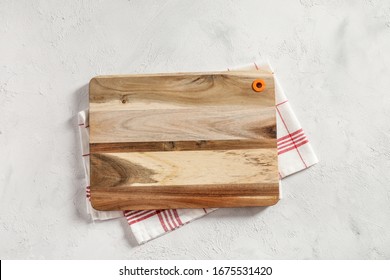 Kitchen Napkin And Cutting Board On White Background